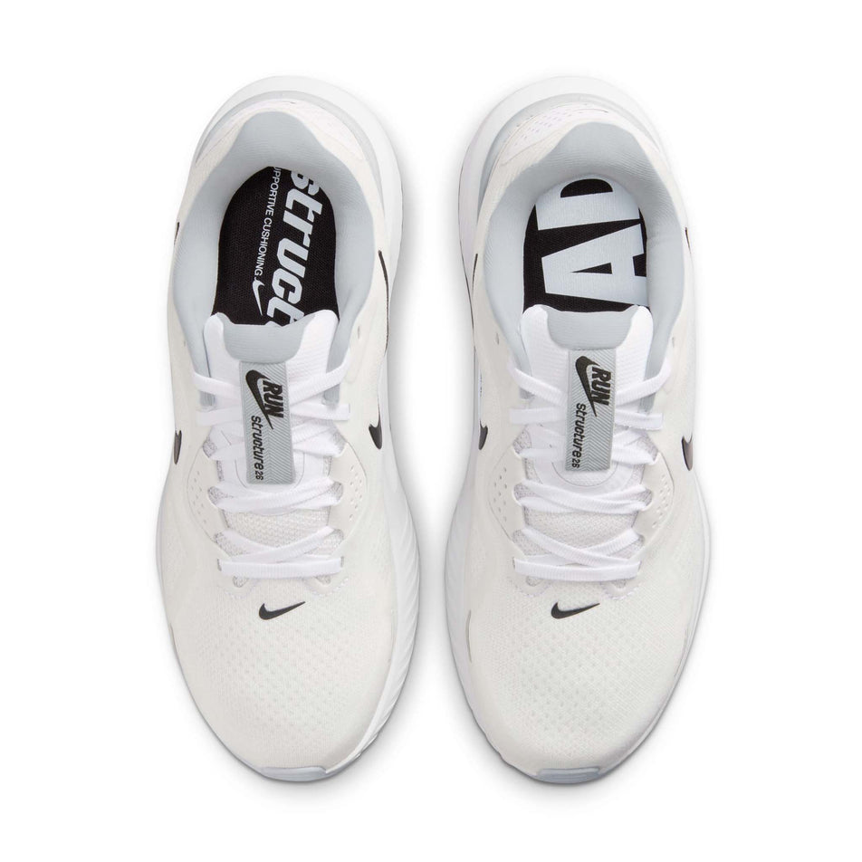 The uppers of a pair of Nike Women's Structure 26 Road Running Shoes in the White/Black-Pure Platinum colourway.