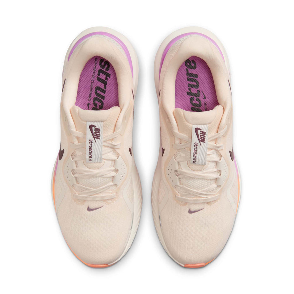 The uppers of a pair of Nike Women's Structure 26 Road Running Shoes in the Chalk/Tattoo-Light Magenta-Orange Pulse colourway.
