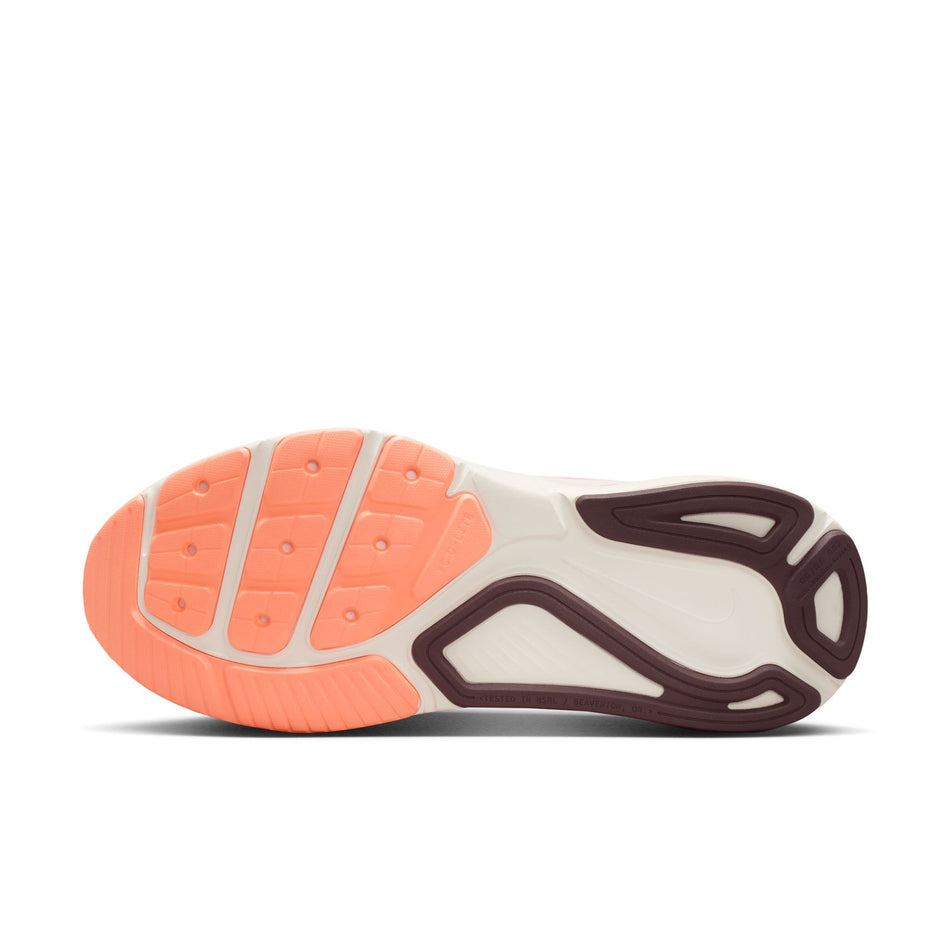 The outsole of the left shoe from a pair of Nike Women's Structure 26 Road Running Shoes in the Chalk/Tattoo-Light Magenta-Orange Pulse colourway.