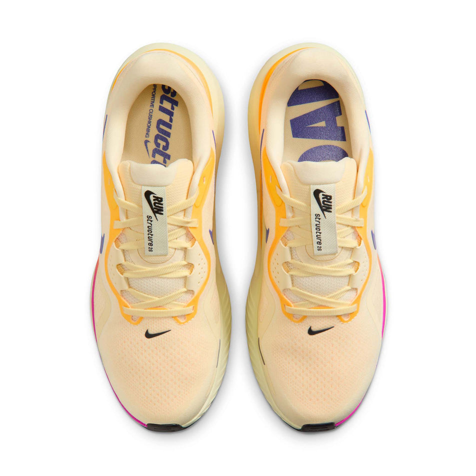 The uppers of a pair of Nike Men's Structure 26 Road Running Shoes in the Alabaster/Indigo Burst-Hyper Violet colourway.
