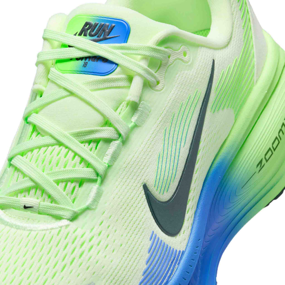 Close-up view of the upper of the left shoe from a pair of Nike Men's Vomero 18 Road Running Shoes in the White/Black Spruce-Volt Tint-Sapphire colourway.