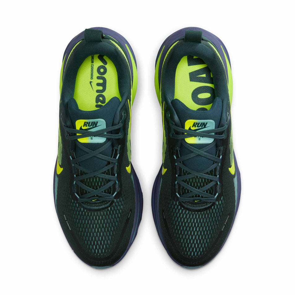 The uppers of a pair of Nike Men's Vomero 18 Road Running Shoes in the Seaweed/Volt-Cannon-Sanded Purple colourway.
