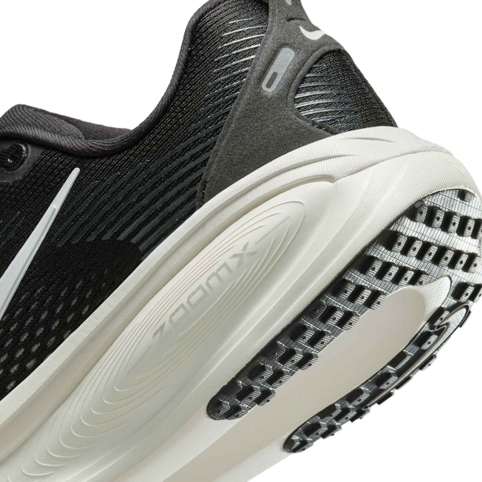 Close up of the midsole of the left shoe from a pair of Nike Women's Vomero 18 Road Running Shoes in the Black/Summit White-Coconut Milk colourway. (8686787657890)