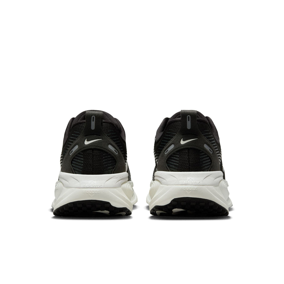 The back of a pair of Nike Women's Vomero 18 Road Running Shoes in the Black/Summit White-Coconut Milk colourway. (8686787657890)