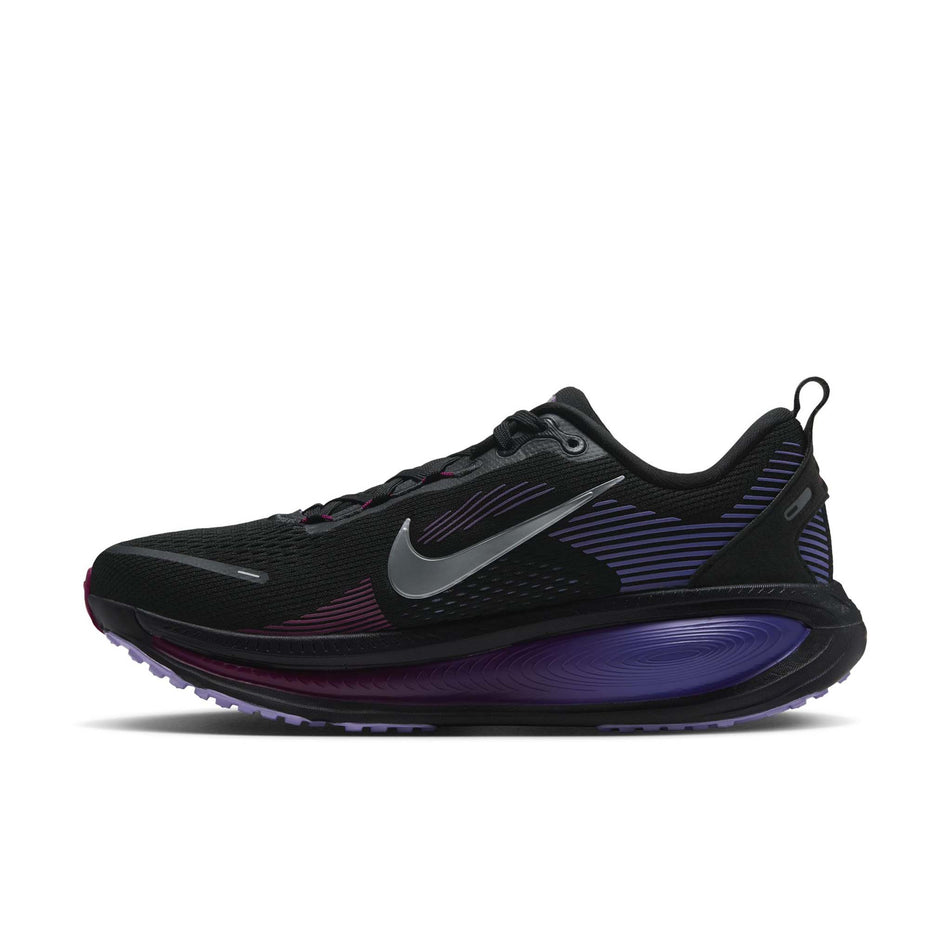Medial view of the right shoe from a pair of Nike Women's Vomero 18 Road Running Shoes in the Black/Metallic Silver-Persian Violet colourway.