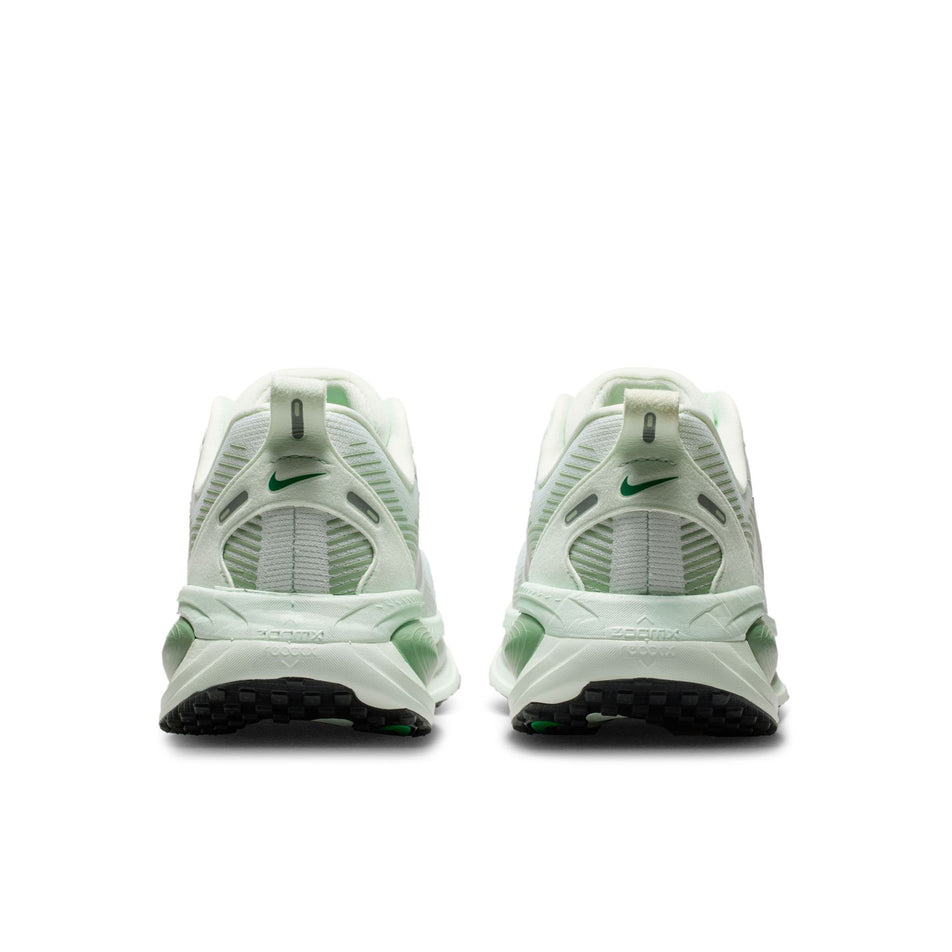 The back of a pair of Nike Women's Vomero 18 Road Running Shoes in the Barely Green/Metallic Silver-Steam colourway. 