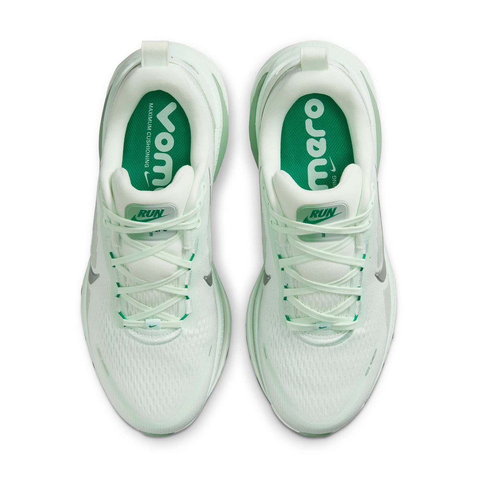 The uppers of a pair of Nike Women's Vomero 18 Road Running Shoes in the Barely Green/Metallic Silver-Steam colourway. 