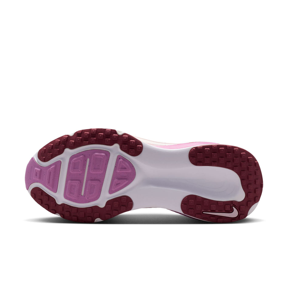 The outsole of the left shoe from a pair of Nike Women's Vomero 18 Road Running Shoes in the Bleached Lilac/Pink Smoke-Light Magenta colourway.