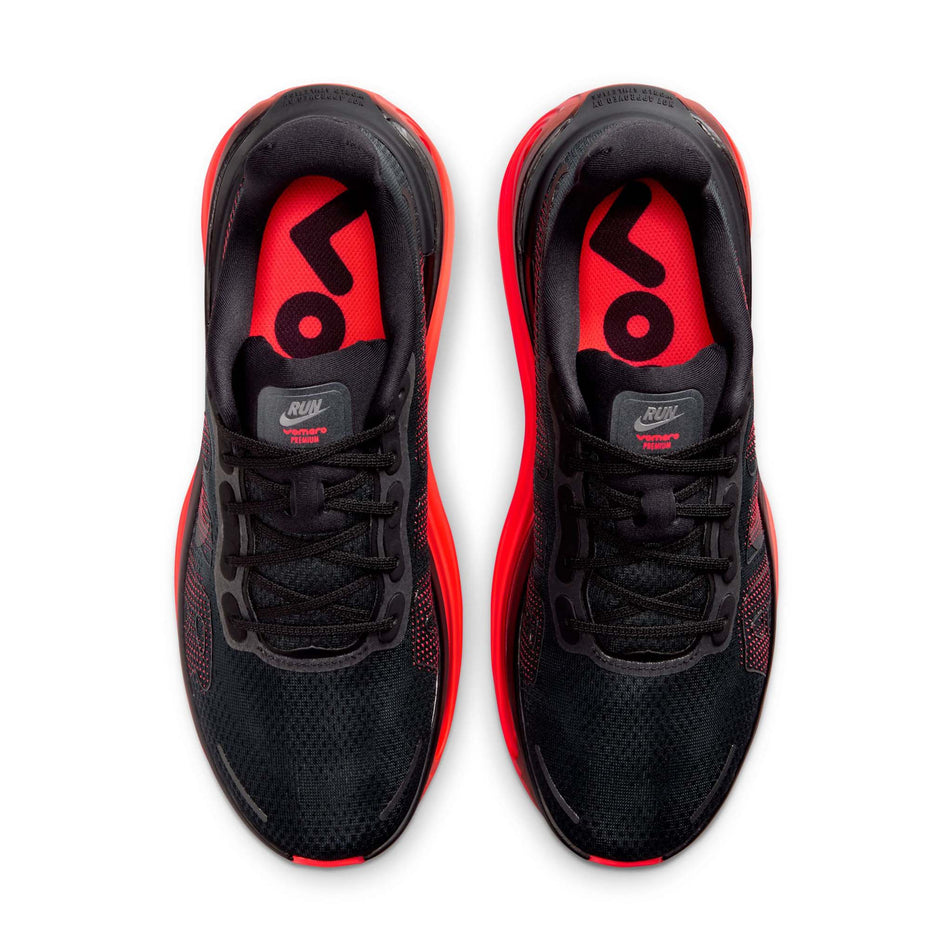 The uppers of a pair of Nike Men's Vomero Premium Road Running Shoes in the Black/Black-Bright Crimson colourway.