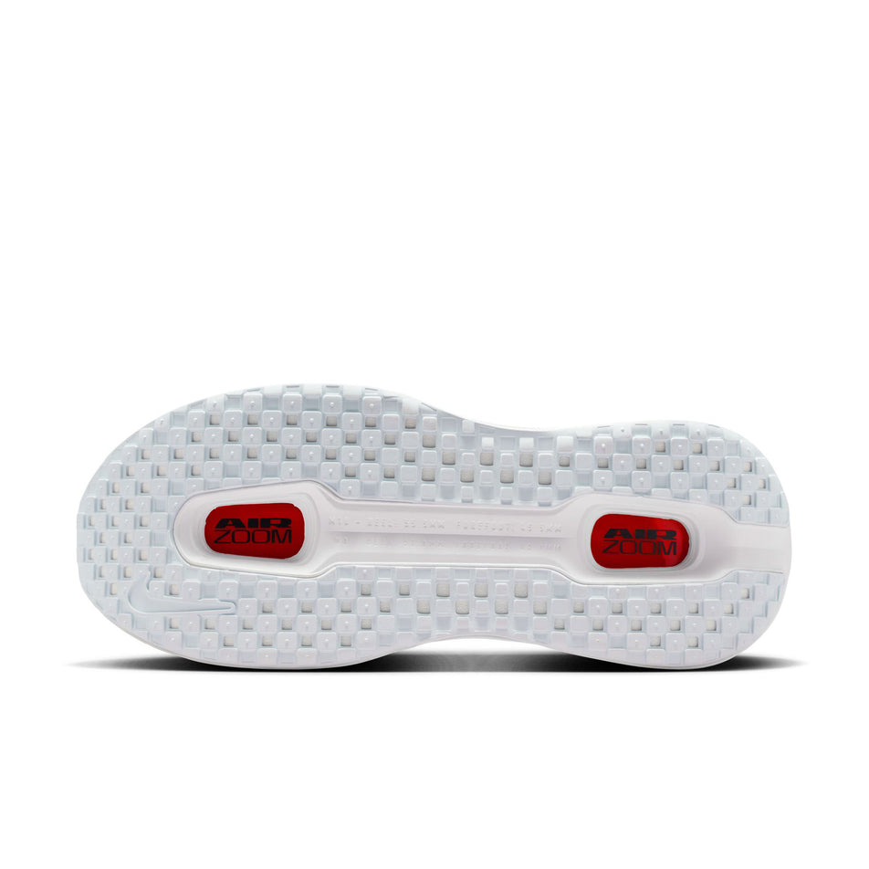 The outsole of the left shoe from a pair of Nike Men's Vomero Premium Road Running Shoes in the White/Black-Bright Crimson-Photon Dust colourway.