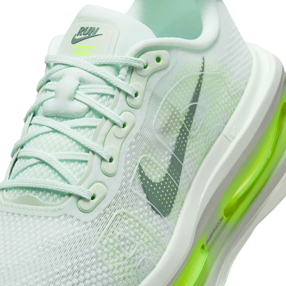 Close-up view of the upper of the left shoe from a pair of Nike Men's Vomero Premium Running Shoes in the Barely Green/Clay Green-Barely Volt-Volt colourway. (8754887295138)