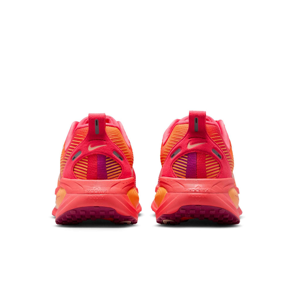 The back of a pair of Nike Women's Vomero 18 SE Road Running Shoes in the Ember Glow/Washed Coral-Sweet Beet colourway. (8725394751650)