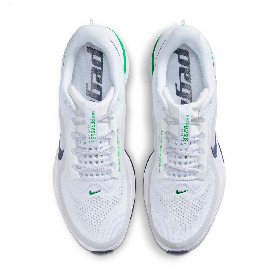 The uppers of a pair of Nike Men's Pegasus Premium Road Running Shoes in the White/Green Spark-Midnight Navy colourway.