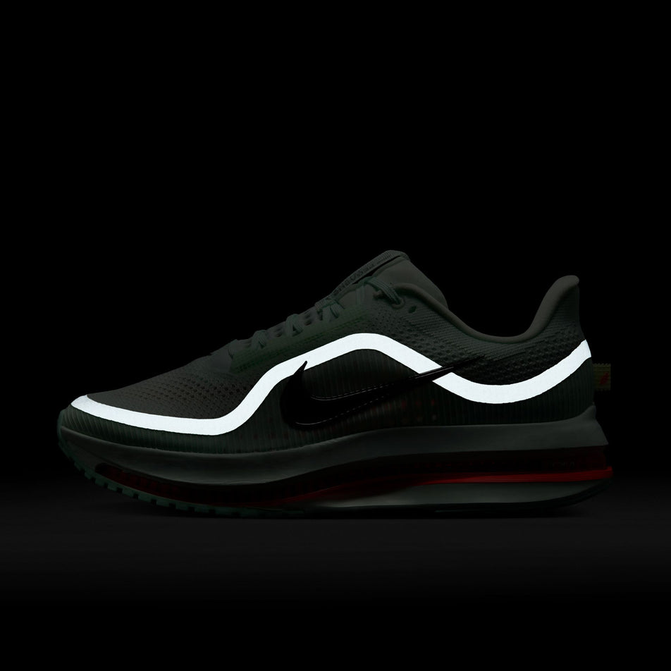 The reflective graphic on the lateral side of the left shoe from a pair of Nike Men's Pegasus Premium Road Running Shoes in the Barely Green/Bright Crimson-Mint Foam colourway. (8683294982306)