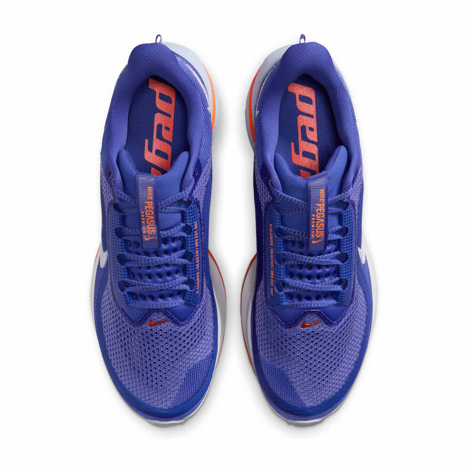 The uppers of a pair of Nike Men's Pegasus Premium Road Running Shoes in the Lapis/White-Total Orange-Off Noir colourway.