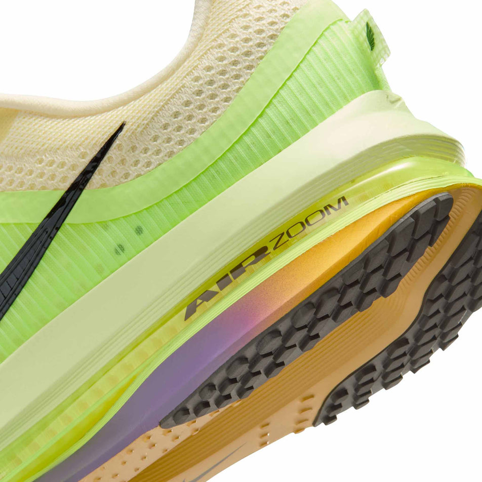 Close-up view of the rearfoot section of the left shoe from a pair of Nike Men's Pegasus Premium Road Running Shoes in the Alabaster/Black-Barely Volt-Volt Ice colourway.