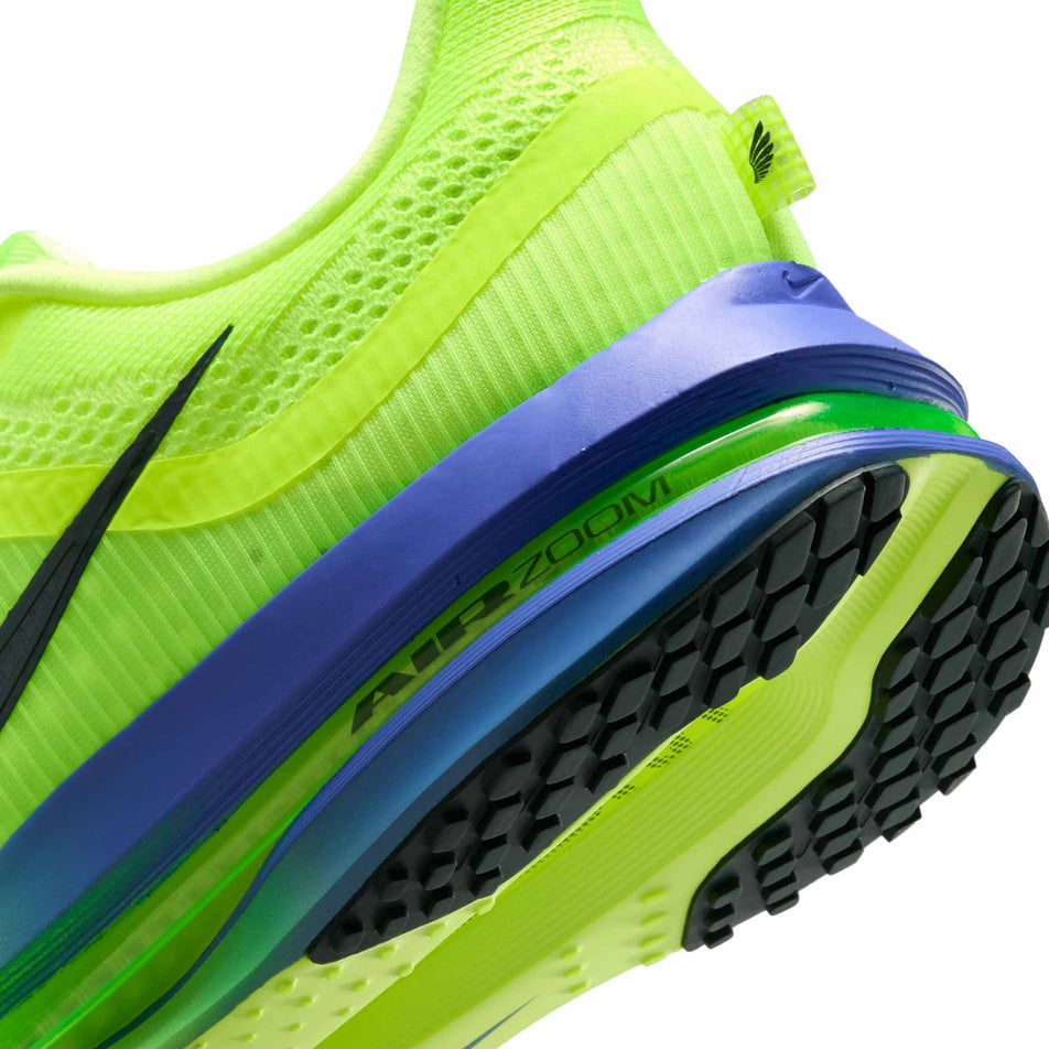 Close-up view of the rearfoot section of the left shoe from a pair of Nike Men's Pegasus Premium Road Running Shoes in the Volt Ice/Black Spruce-Lime Blast colourway.