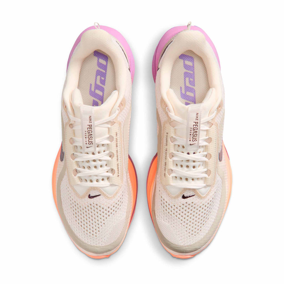 The uppers of a pair of Nike Women's Pegasus Premium Road Running Shoes in the Chalk/Tattoo-Orange Pulse-Light Magenta colourway.