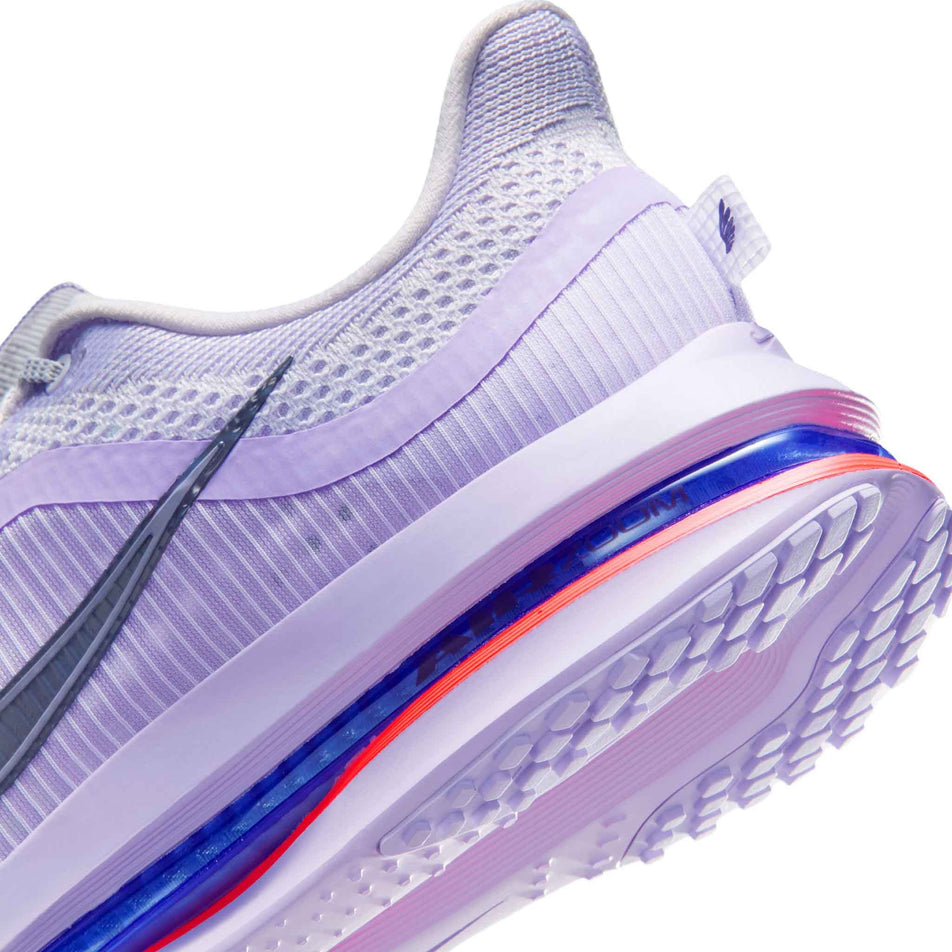 Close-up view of the rearfoot section of the left shoe from a pair of Nike Women's Pegasus Premium Road Running Shoes in the Barely Grape/Purple Dynasty-Violet Mist colourway.