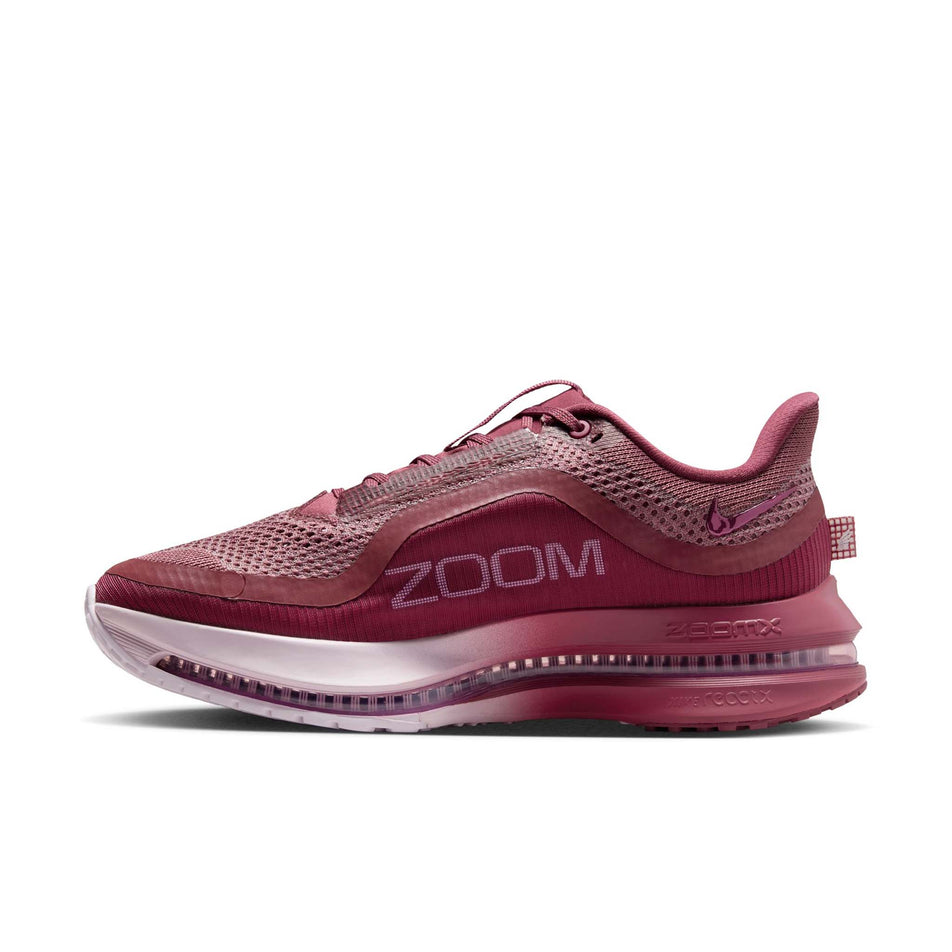 Medial view of the right shoe from a pair of Nike Women's Pegasus Premium Road Running Shoes in the Pink Smoke/Pink Smoke-Light Magenta colourway.