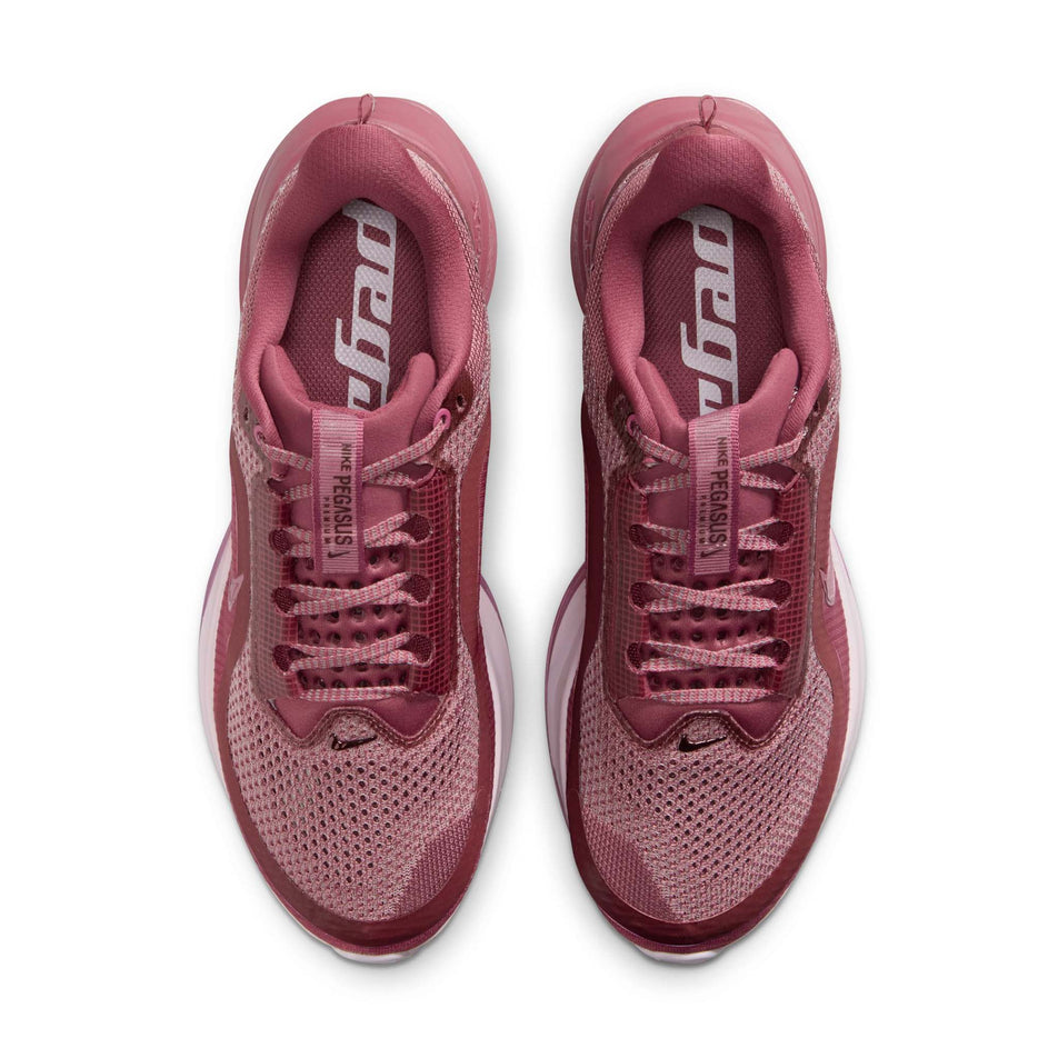 The uppers of a pair of Nike Women's Pegasus Premium Road Running Shoes in the Pink Smoke/Pink Smoke-Light Magenta colourway.