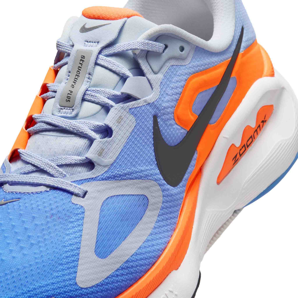 Close-up view of the upper of the left shoe from a pair of the Nike Men's Structure Plus Road Running Shoes in the Hydrogen Blue/Off Noir-Blue Crystal colourway.