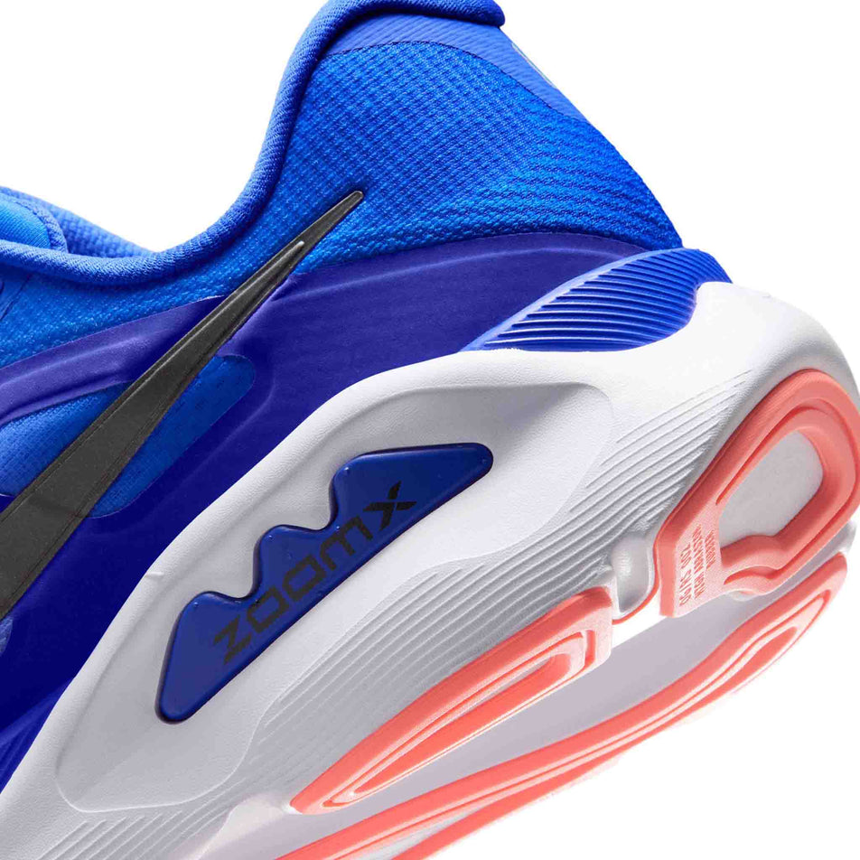 Close-up view of the rearfoot section of the left shoe from a pair of Nike Men's Structure Plus Road Running Shoes in the Racer Blue/Black-Atomic Pink-White colourway.