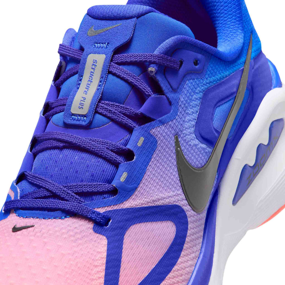 Close-up view of the upper of the left shoe from a pair of Nike Men's Structure Plus Road Running Shoes in the Racer Blue/Black-Atomic Pink-White colourway.