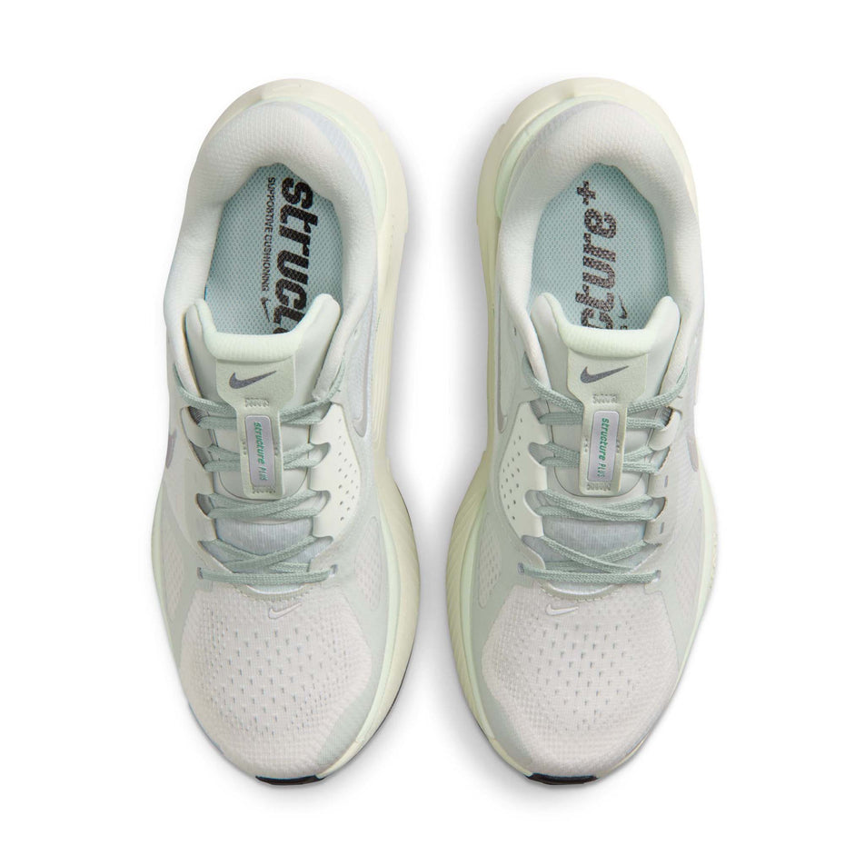 The uppers of a pair of Nike Women's Structure Plus Road Running Shoes in the Light Silver/Metallic Silver colourway.