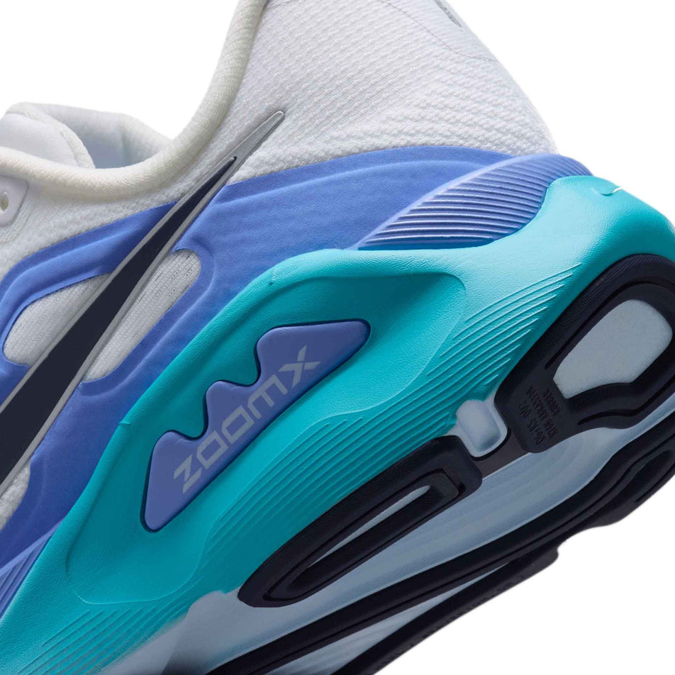 Close-up view of the rearfoot section of the left shoe from a pair of Nike Women's Structure Plus Road Running Shoes in the White/Midnight Navy-Royal Pulse colourway.