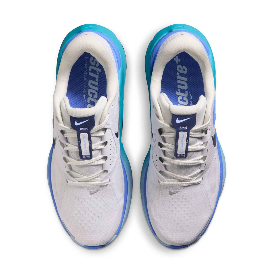 The uppers of a pair of Nike Women's Structure Plus Road Running Shoes in the White/Midnight Navy-Royal Pulse colourway.
