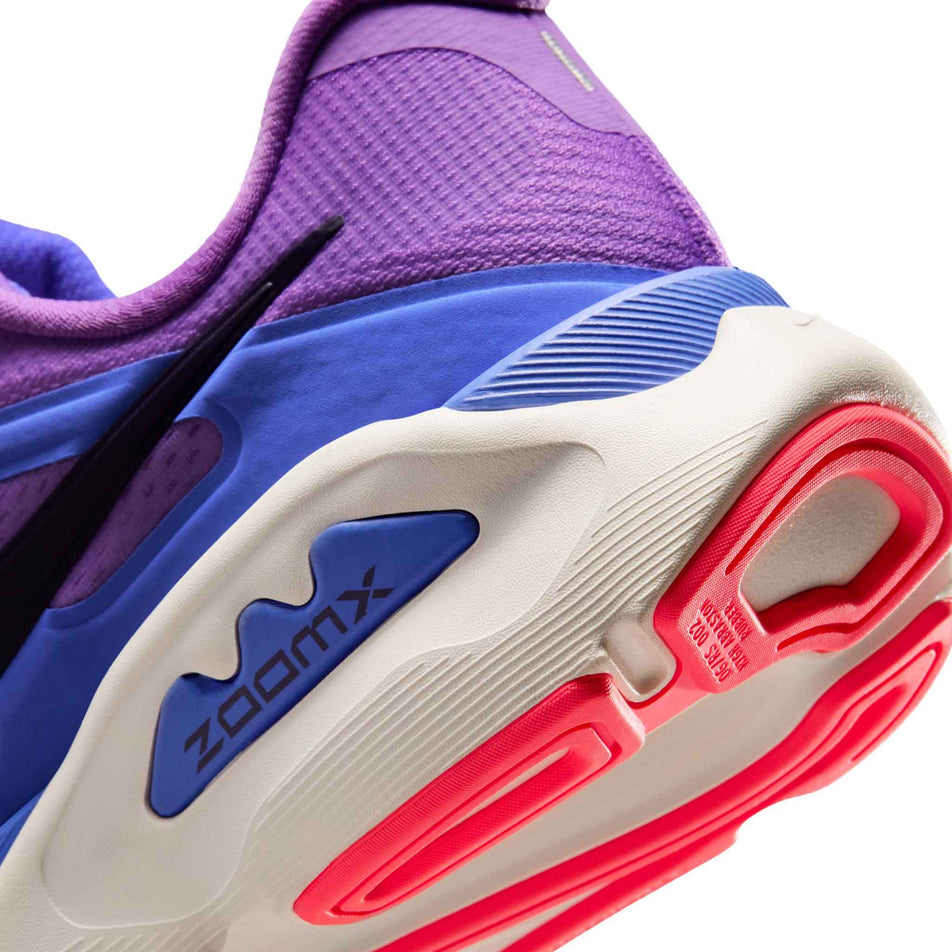 Close-up view of the rearfoot section of the left shoe from a pair of Nike Women's Structure Plus Road Running Shoes in the Bright Violet/Purple Dynasty-Violet Mist colourway.