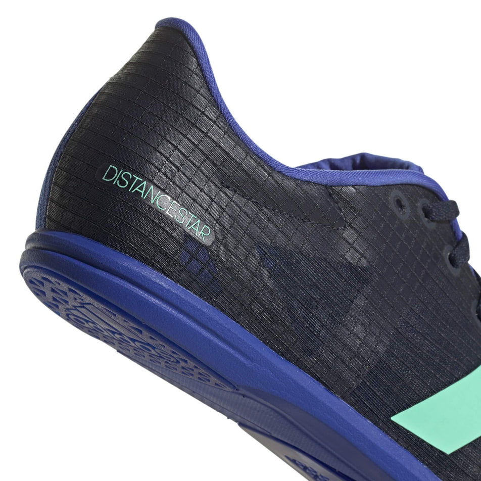 Lateral side of the heel counter on a pair of adidas Unisex Distancestar Running Spikes in the Legend Ink/Pulse Mint colourway (7916227494050)