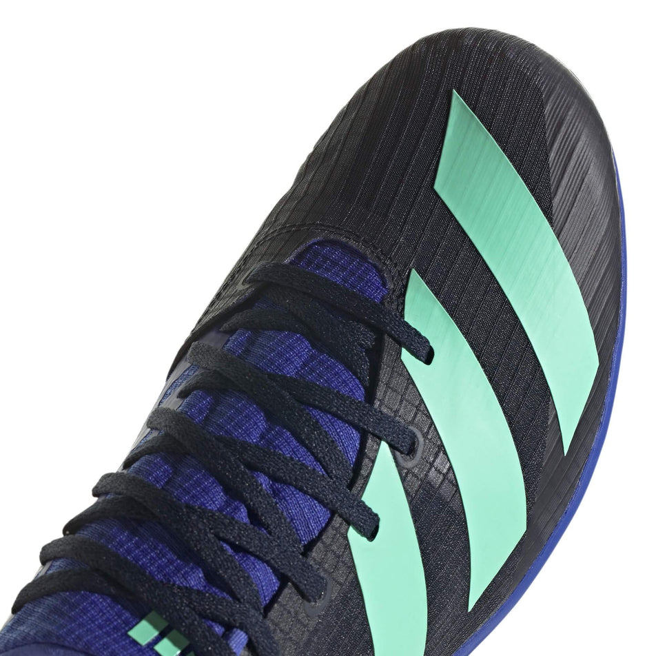 The toe box on the right shoe from a pair of adidas Unisex Distancestar Running Spikes in the Legend Ink/Pulse Mint colourway (7916227494050)