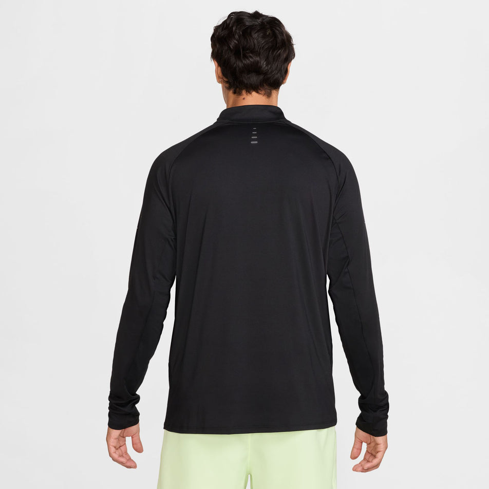 Back view of a model wearing the Nike Men's Stride Dri-FIT 1/4-Zip Running Top in the Black/Reflective Silver  colourway. (8778198876322)