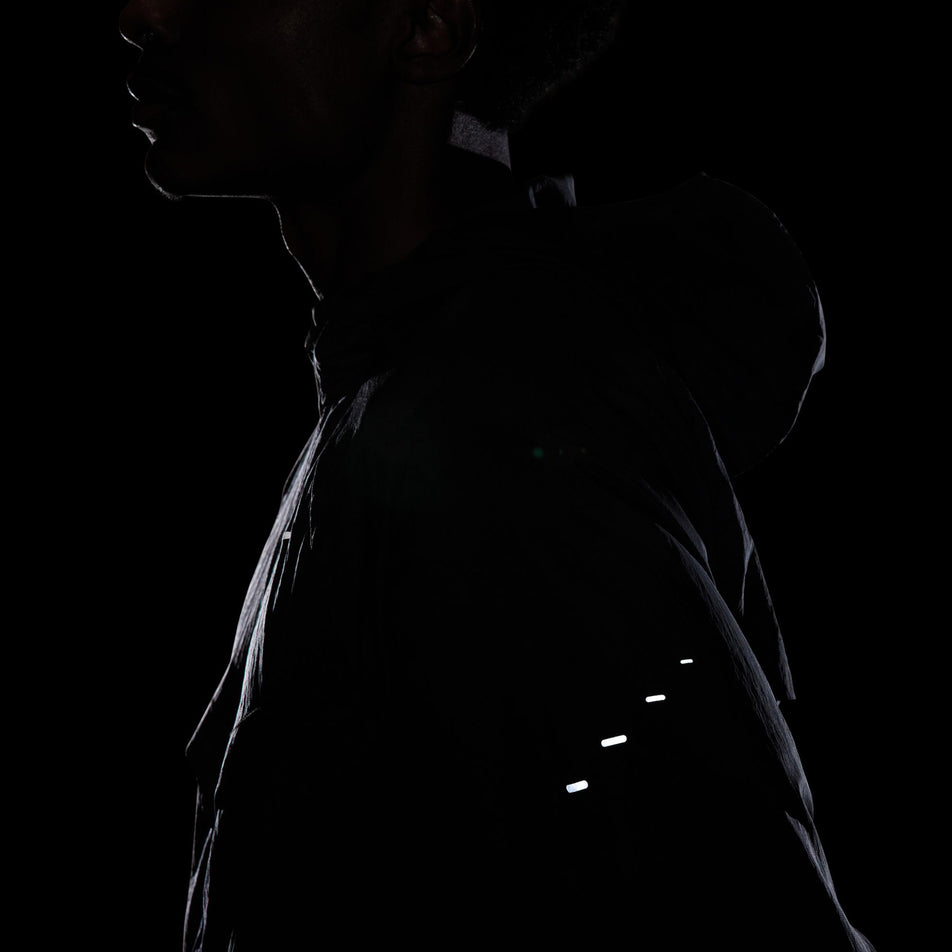 The reflective pills in the side of the Nike Men's Stride Repel UV Running Jacket in the Black/Black/Reflective Silver colourway.