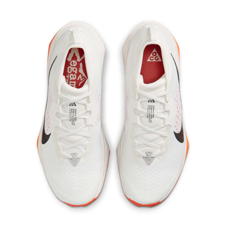 The uppers of a pair of Nike Men's ACG Zegama Trail Running Shoes in the Summit White/Black-Phantom-Safety Orange colourway.