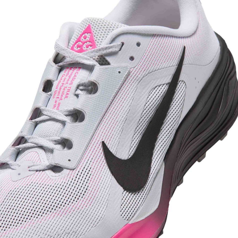 Close-up view of the upper of the left shoe from a pair of Nike Men's ACG Pegasus Trail Running Shoes in the Pure Platinum/Black-Hyper Pink colourway.