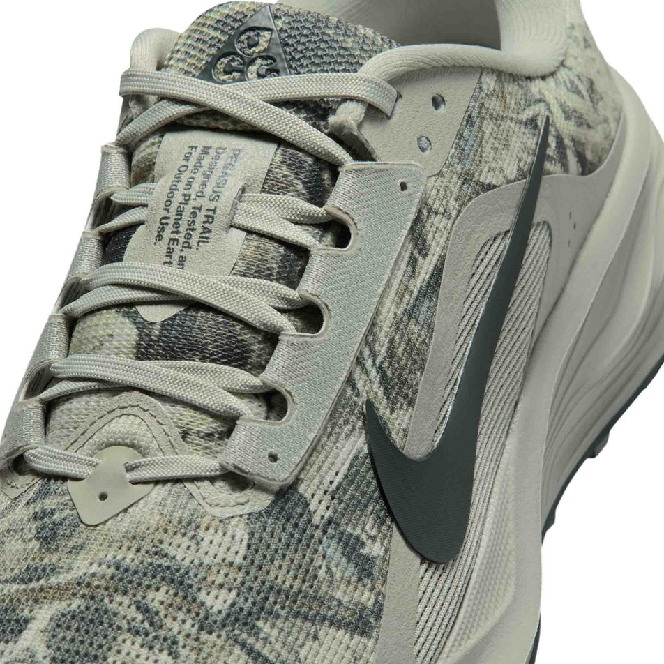 Close-up view of the upper of the left shoe from a pair of Nike Women's ACG Pegasus Trail Running Shoes in the Spruce Fog/Black Spruce-Sea Glass colourway.