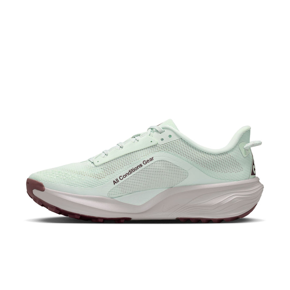 Medial view of the right shoe from a pair of Nike Women's ACG Pegasus Trail Running Shoes in the Barely Green/Silver Lilac-Light Bone colourway.
