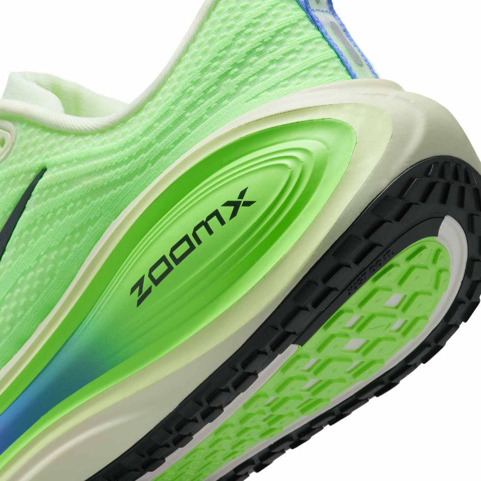 Close-up view of the rearfoot section of the left shoe from a pair of Nike Men's Vomero Plus Road Running Shoes in the Volt Tint/Black Spruce-Lime Blast colourway.