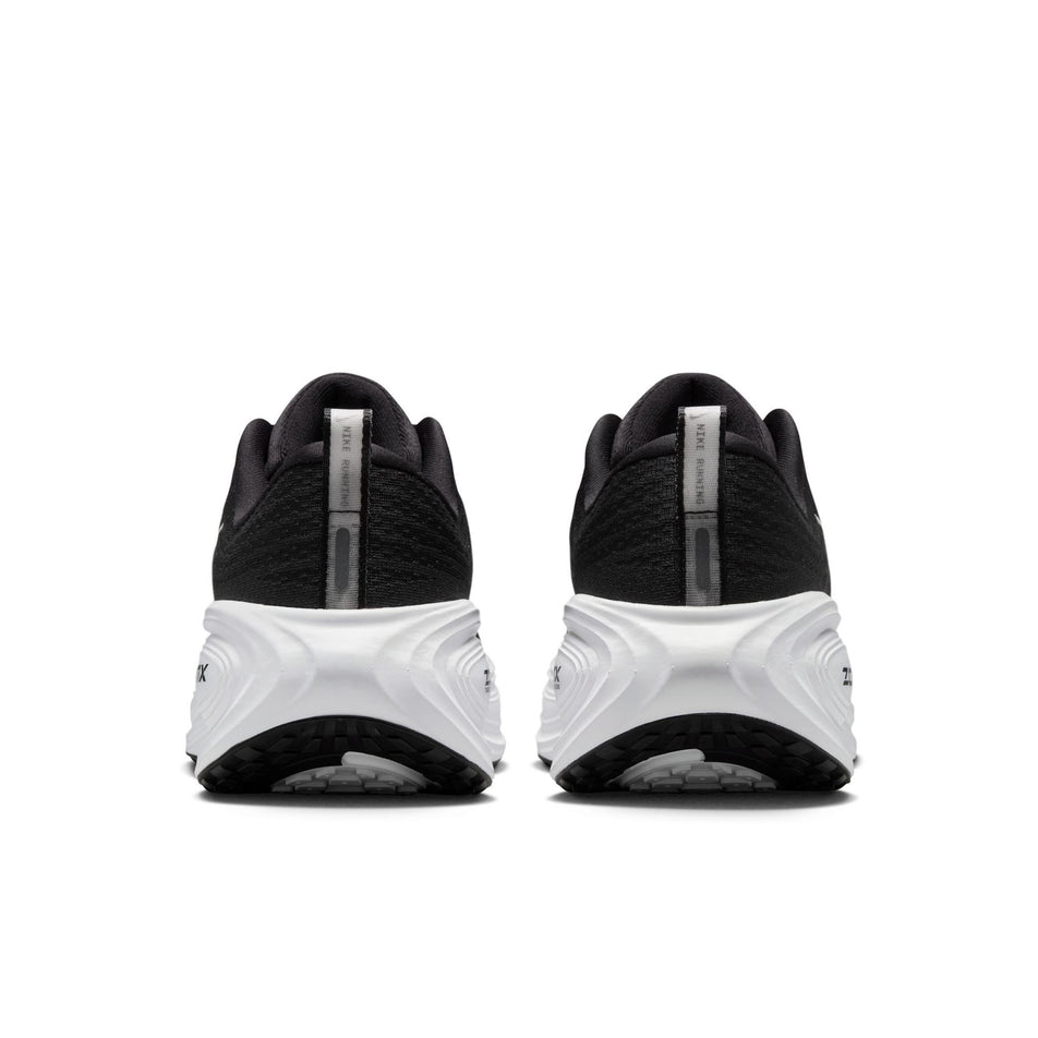 The back of a pair of Nike Women's Vomero Plus Road Running Shoes in the Black/White-Cool Grey Metallic Dark Grey colourway. (8725322170530)