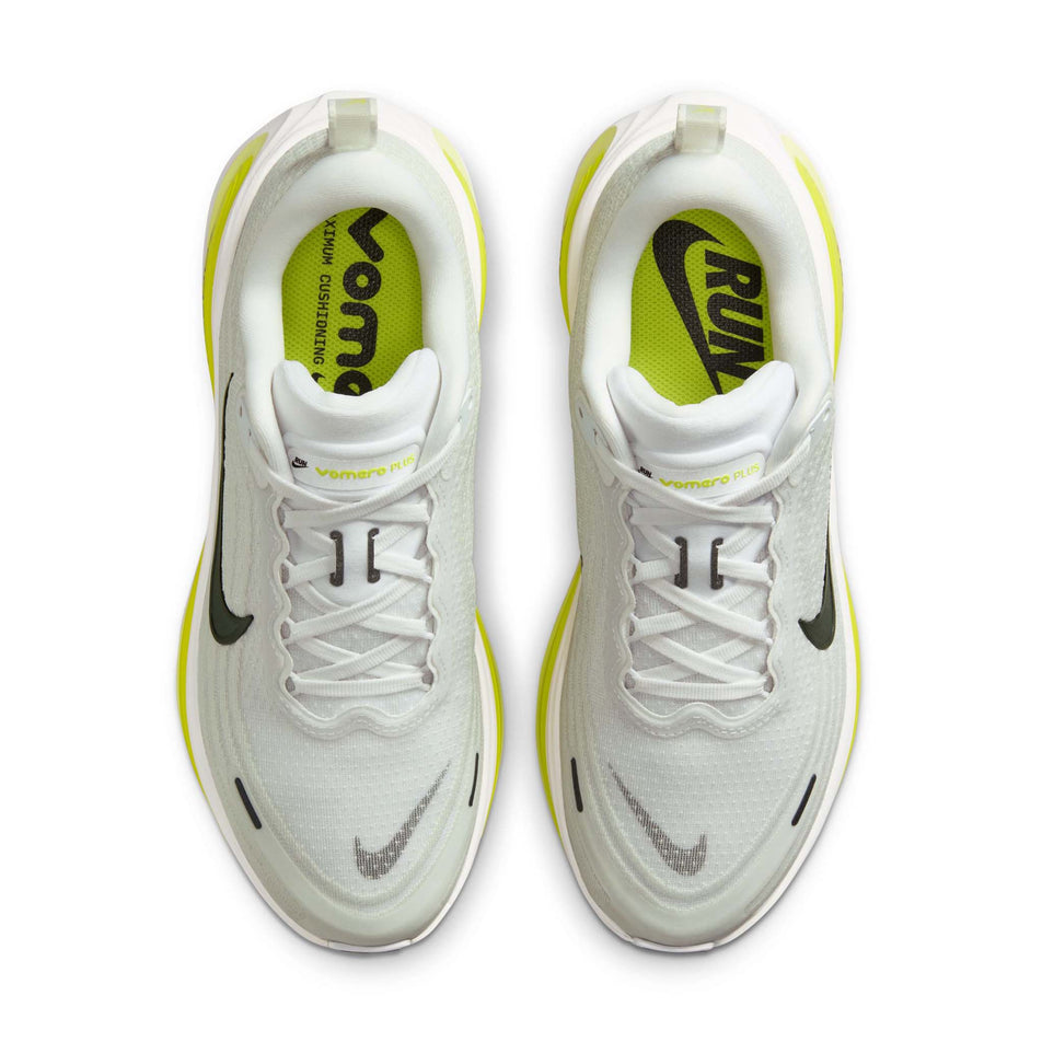 The uppers of a pair of Nike Women's Vomero Plus Road Running Shoes in the White/Black-Cyber-Light Lemon Twist colourway.