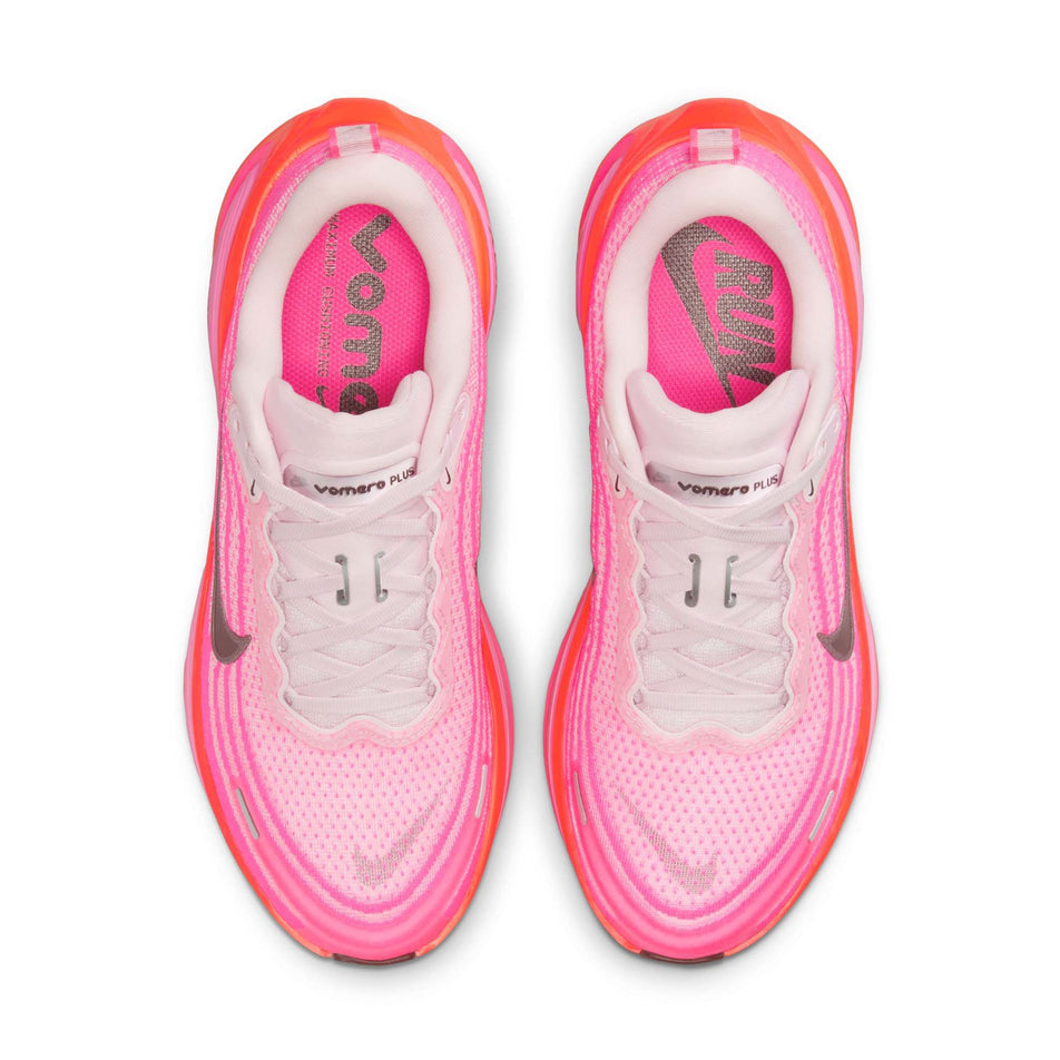 The uppers of a pair of Nike Women's Vomero Plus Road Running Shoes in the Hyper Pink/Burgundy Crush colourway. (8736251773090)