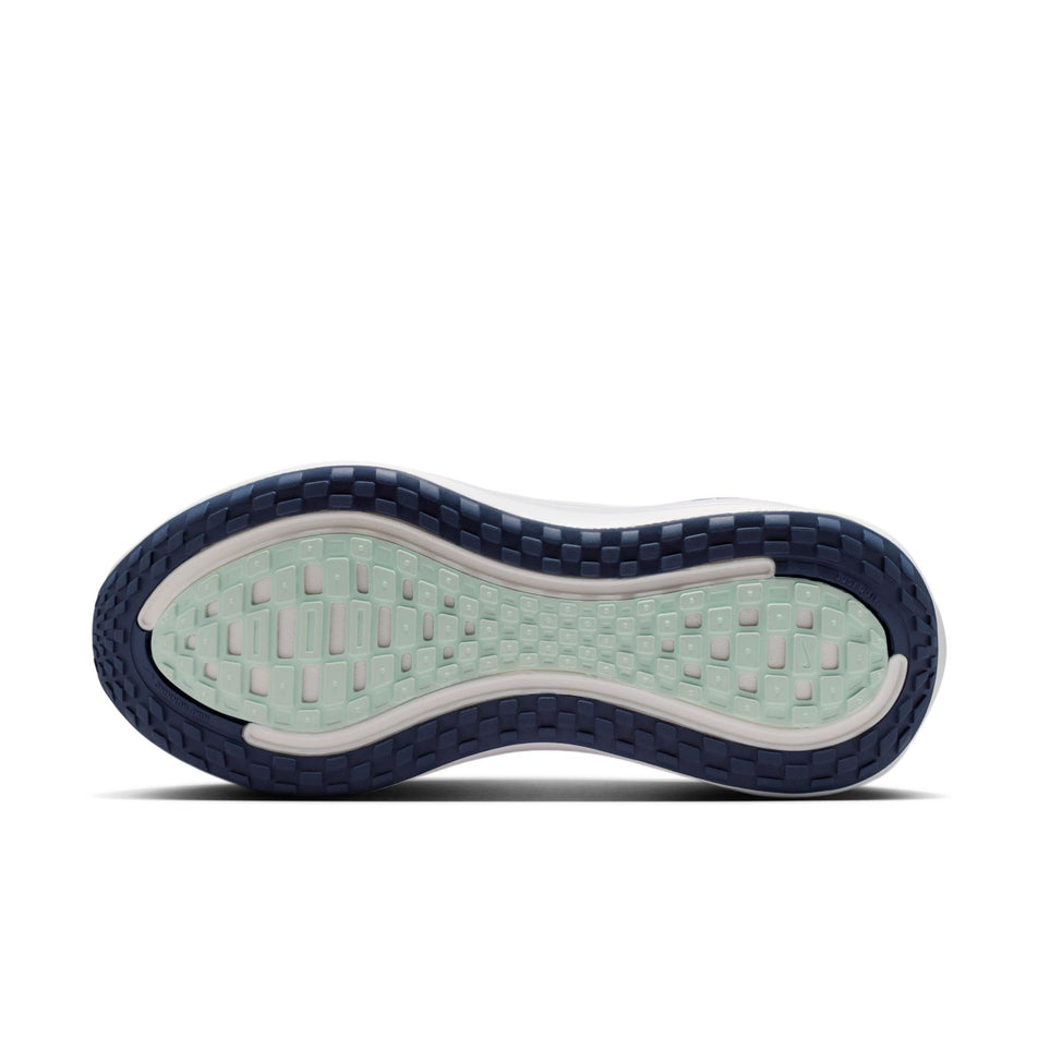The outsole of the left shoe from a pair of Nike Women's Vomero Plus Road Running Shoes in the Pearl Pink/Midnight Navy-White colourway.