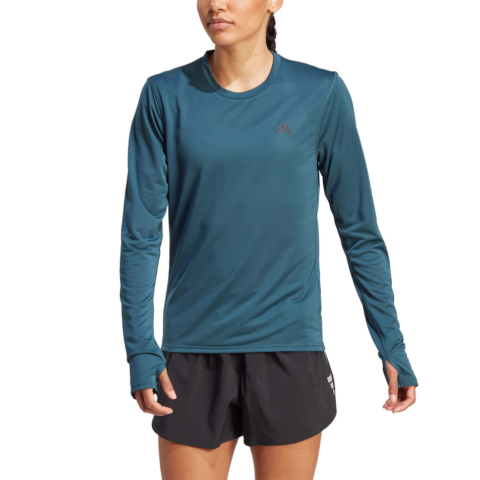 Front view of a model wearing an adidas Women's Run Icons Running Long-Sleeve Top in the Arctic Night colourway (8005336432802)