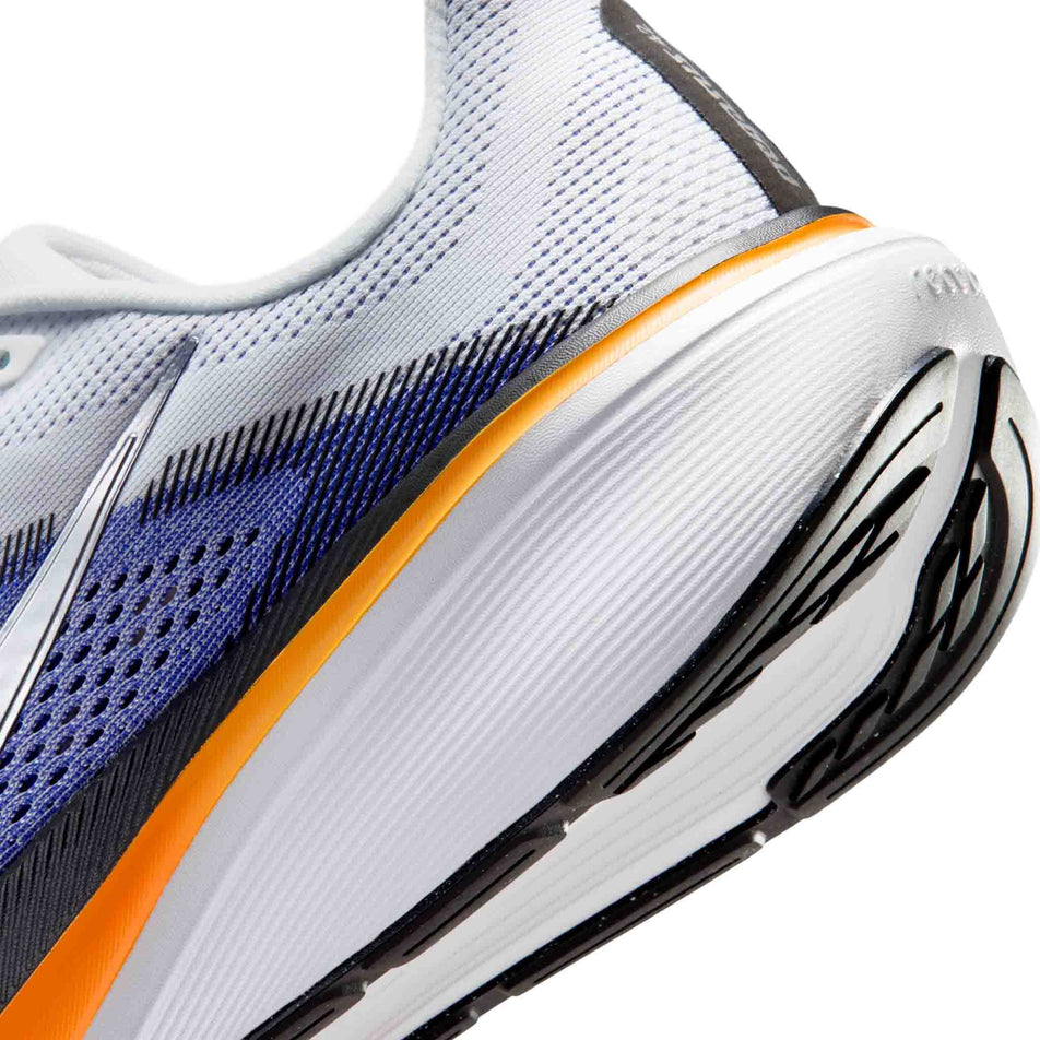 Close-up view of the rearfoot section of the left shoe from a pair of Nike Men's Pegasus 42 Road Running Shoes in the White/Metallic Silver-Lapis-Total Orange colourway.