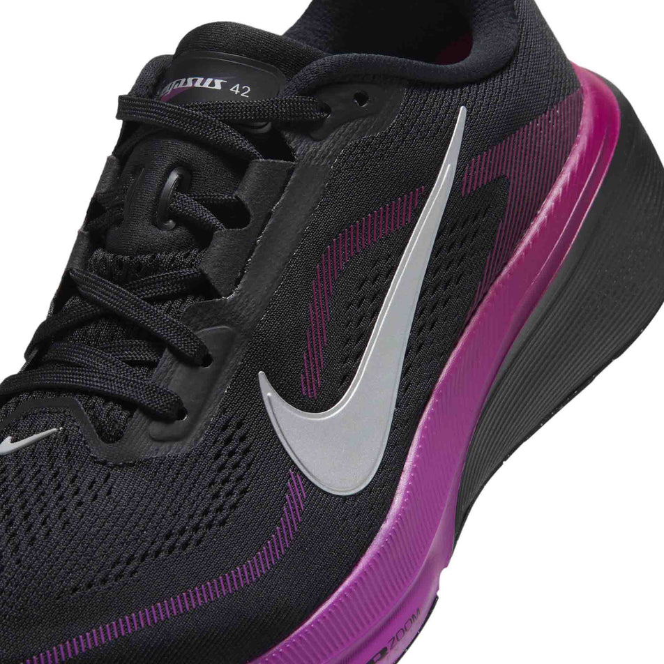 Close-up view of the upper of the left shoe from a pair of Nike Women's Pegasus 42 Road Running Shoes in the Black/Metallic Silver-Vivid Purple colourway.
