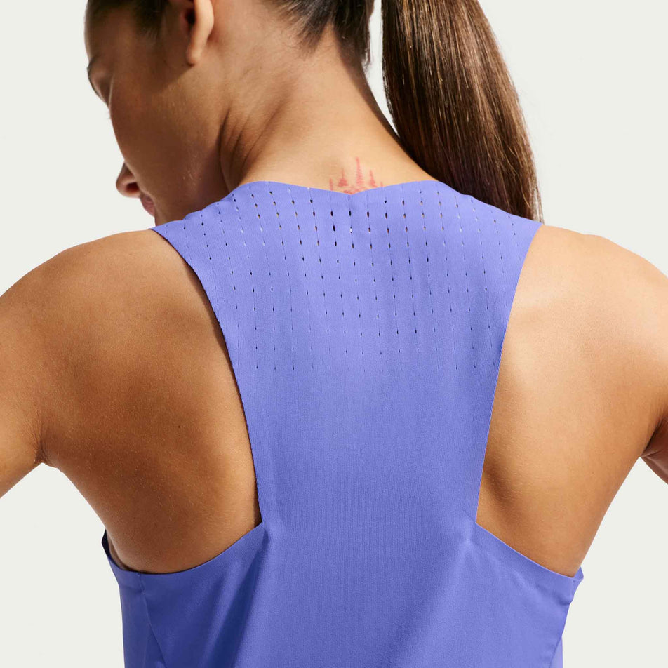 Back view of a model wearing the Nike Women's AeroSwift Dri-FIT ADV Running Singlet in the Sapphire/Black colourway.