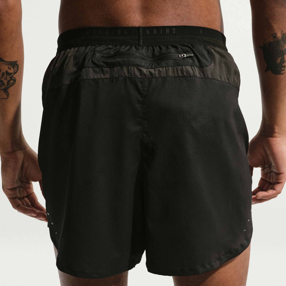 Back view of a model wearing the Nike Men's Stride Plus Dri-FIT 5